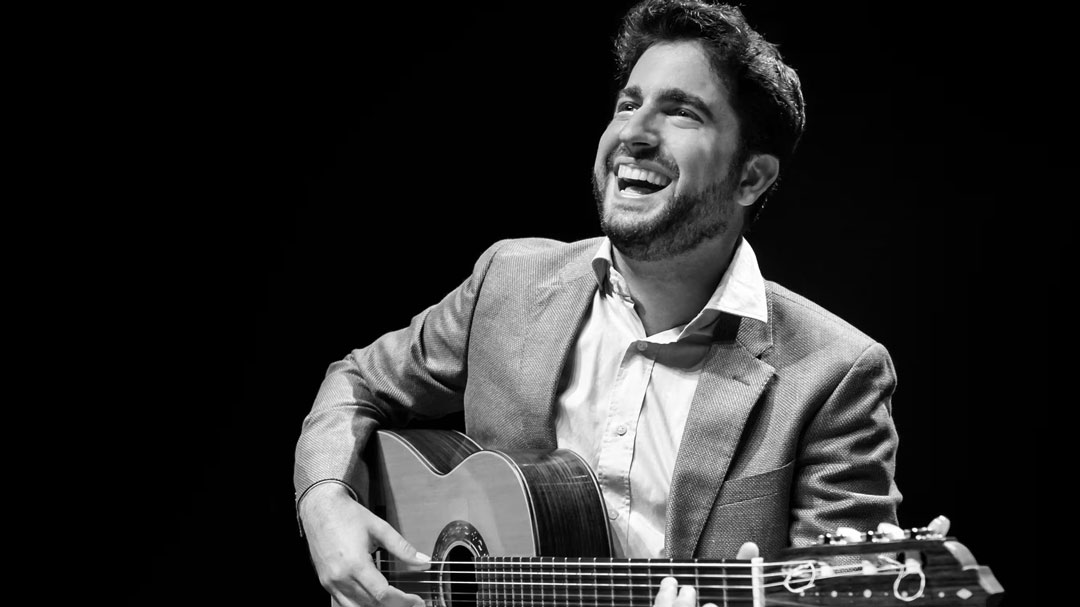 Man playing guitar in City Rhythms: West Side Story and Aranjuez